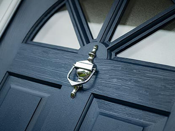 A composite door and knocker