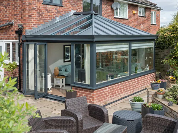 Solid roof conservatory with anthracite grey frames